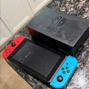 Nintendo Switch Console with Vibrant Red and Blue Controllers